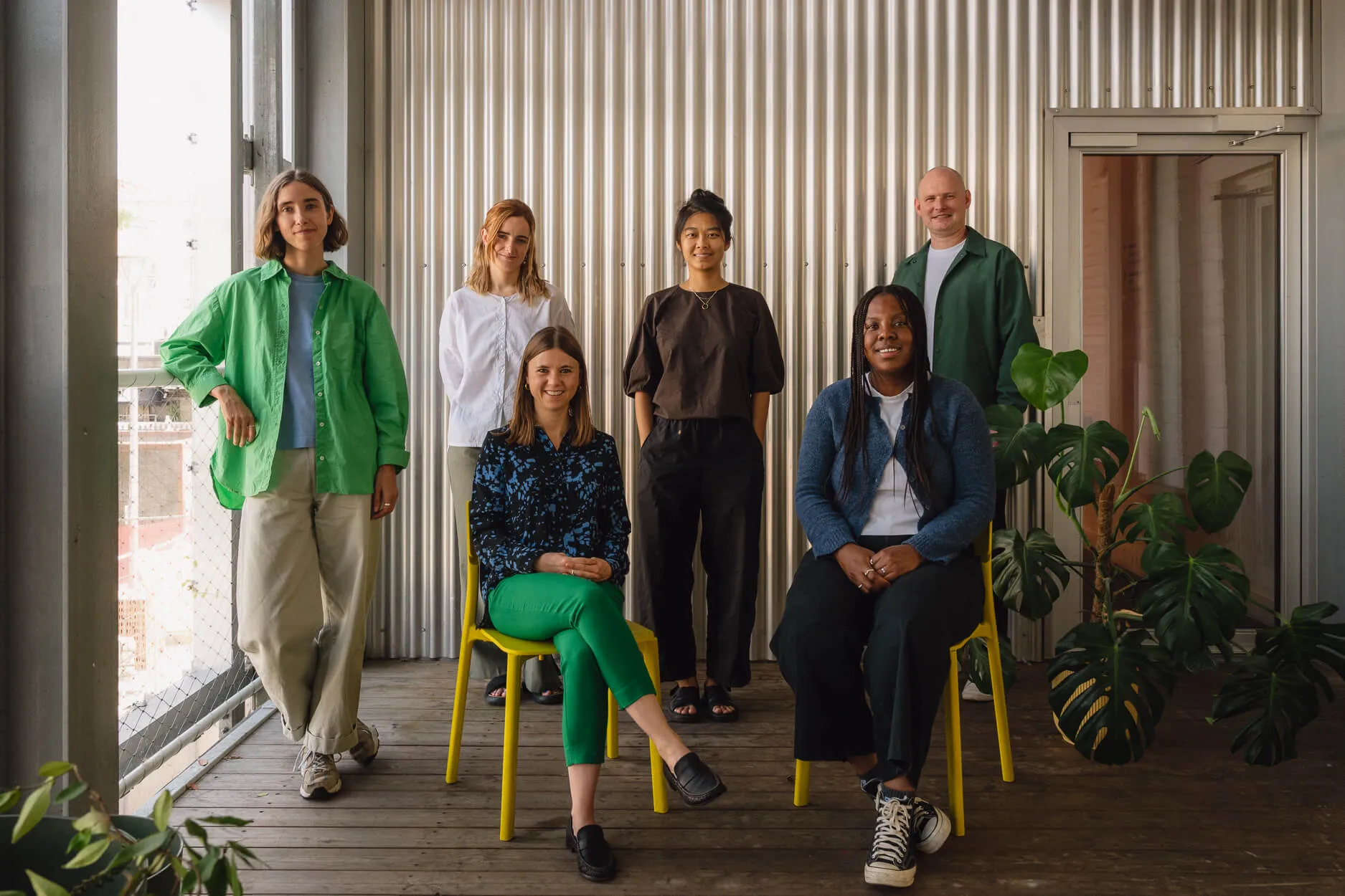 A group photo of Office S&M staff, with all six members, stood on the balcony.
