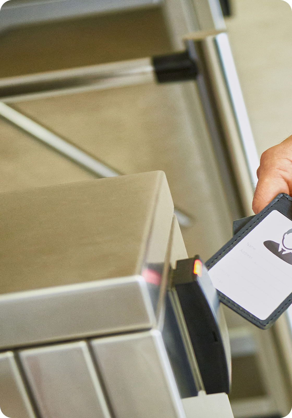 Electronic badge reader with turnstile for controlled access.