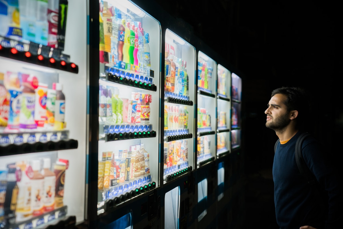 Digital self-service display with product selection interface in vending environment.
