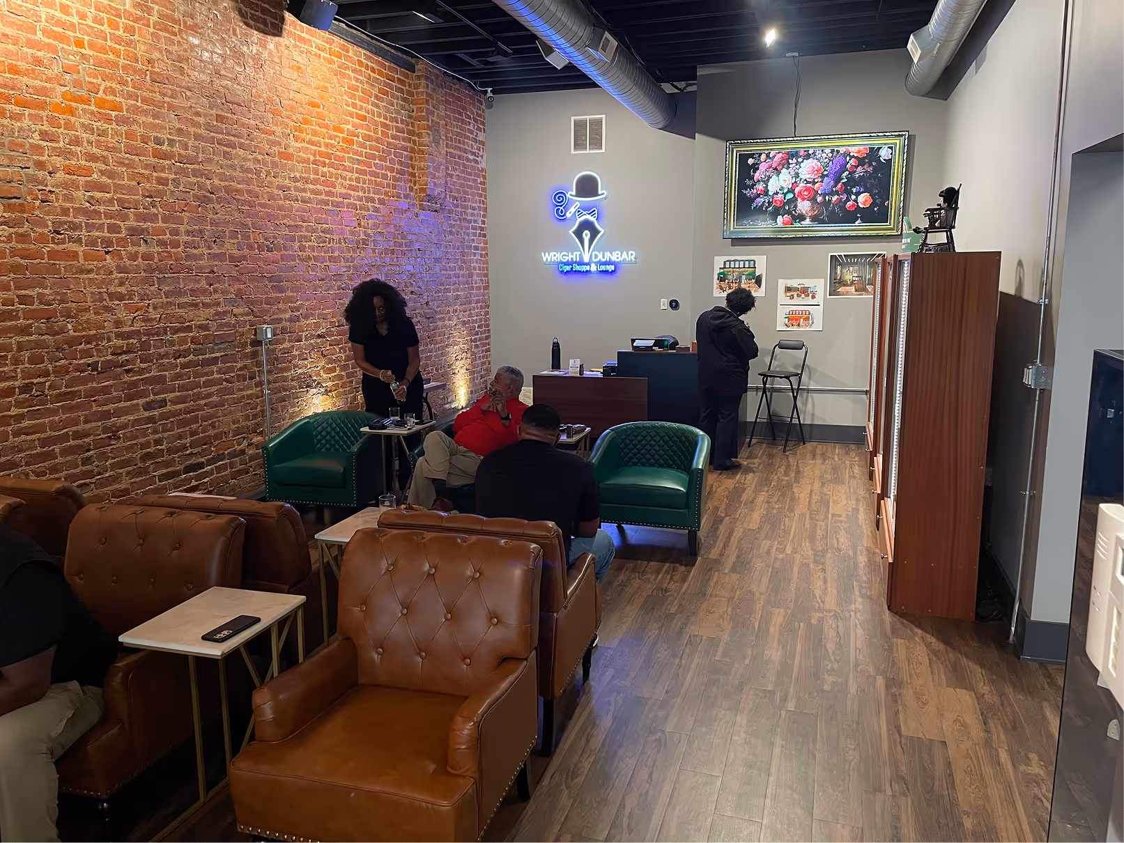 A lounge area inside Wright Dunbar Cigar Lounge next to the humidor cabinets