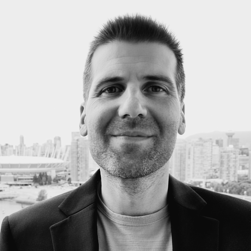 A man with a beard and a black jacket.