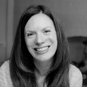 A woman with brown hair smiling for the camera.