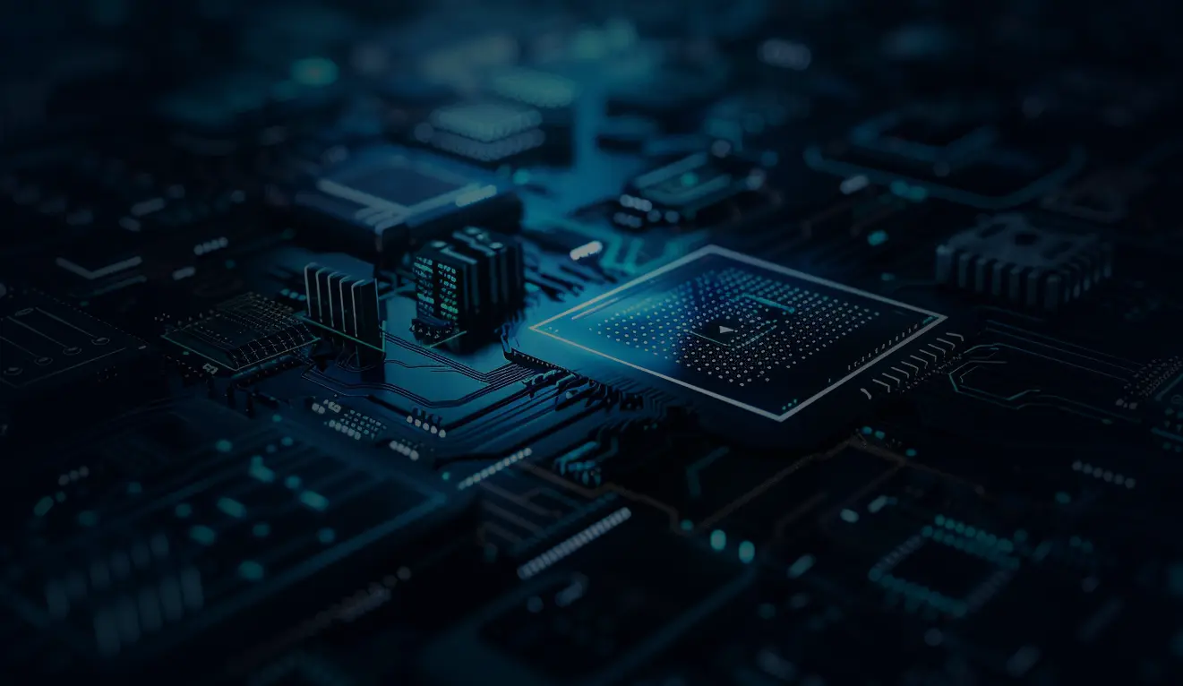 Close-up view of a blue-lit electronic circuit board with various microchips and components.
