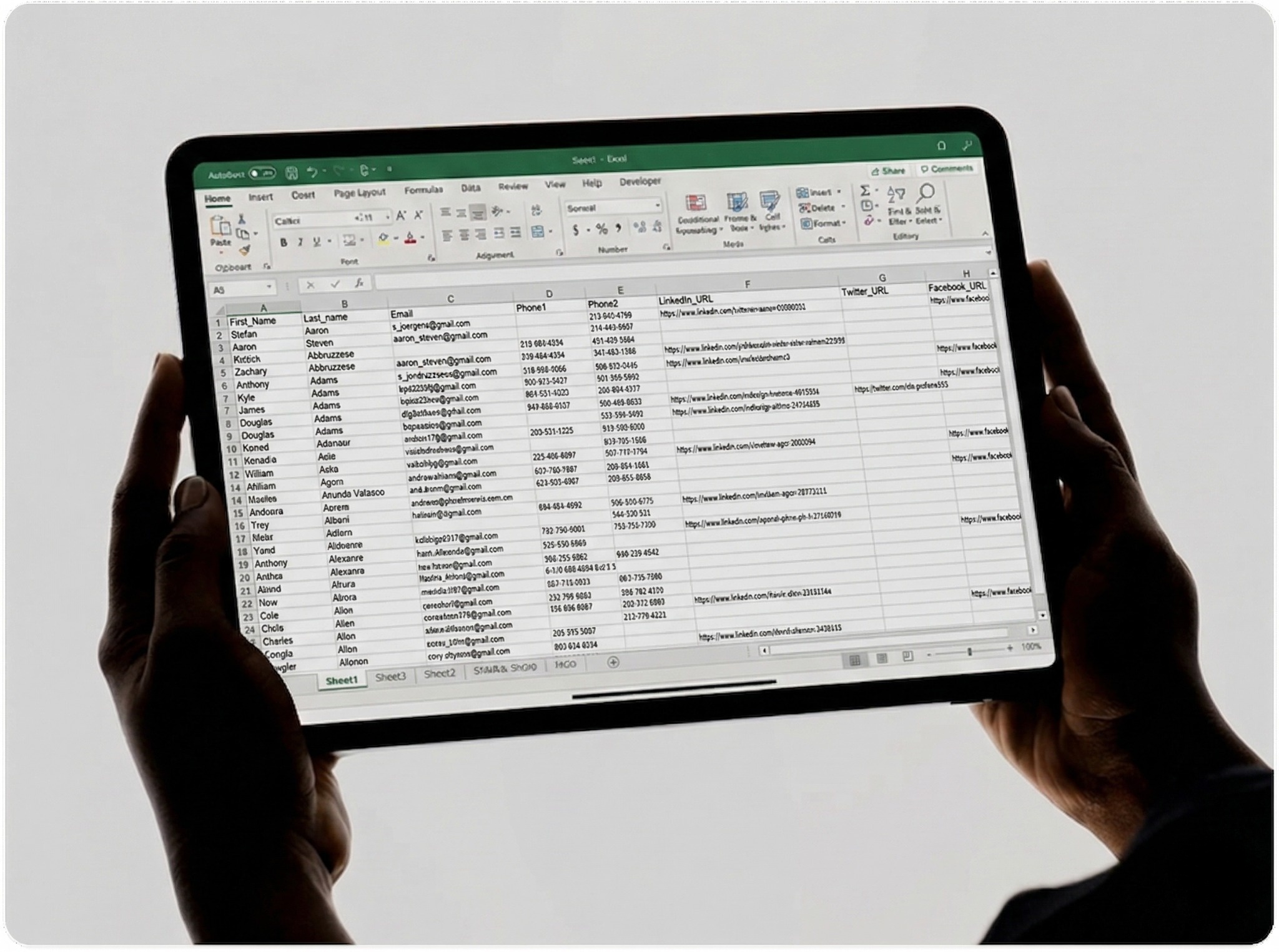 A silhouetted person holds a tablet displaying a document with text and an image of a building, set against a vivid red background.