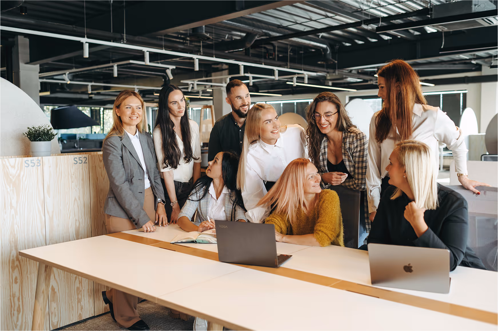 A team of people looking happy in an office space