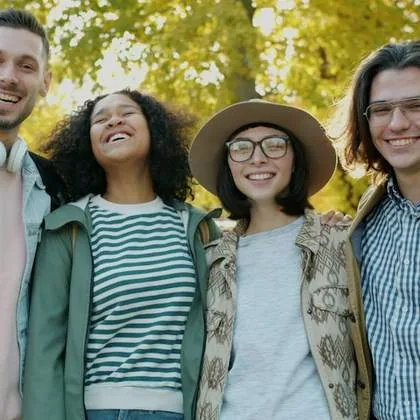 Three friends smiling together