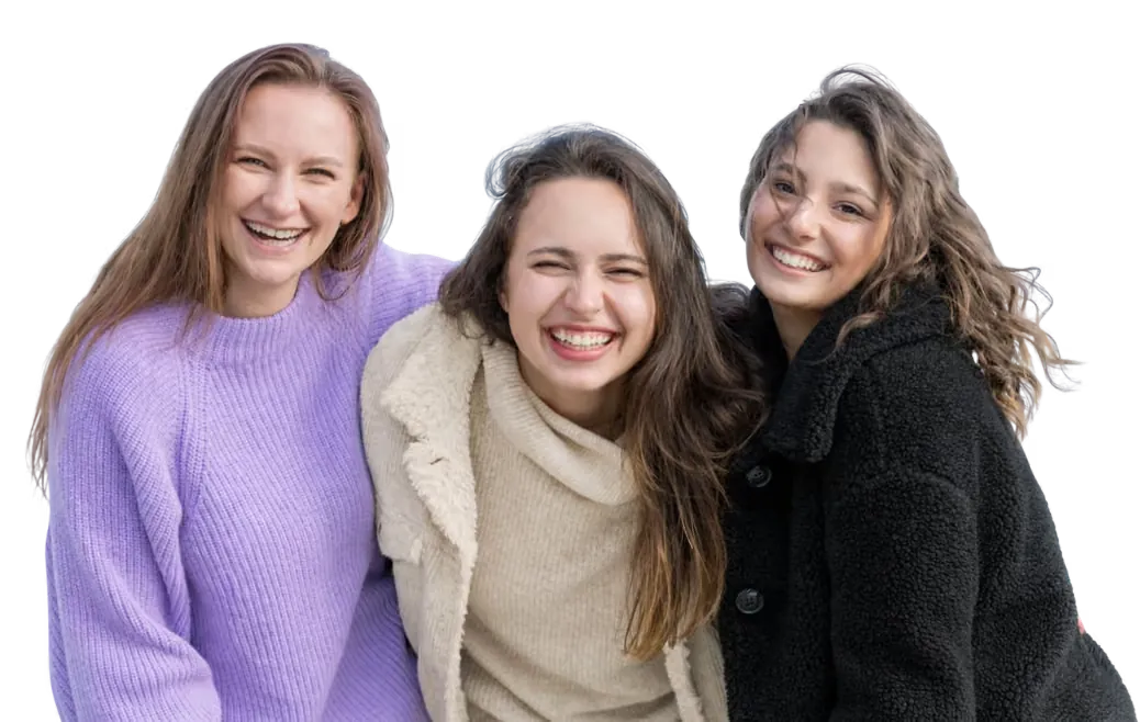 Three community members smiling together