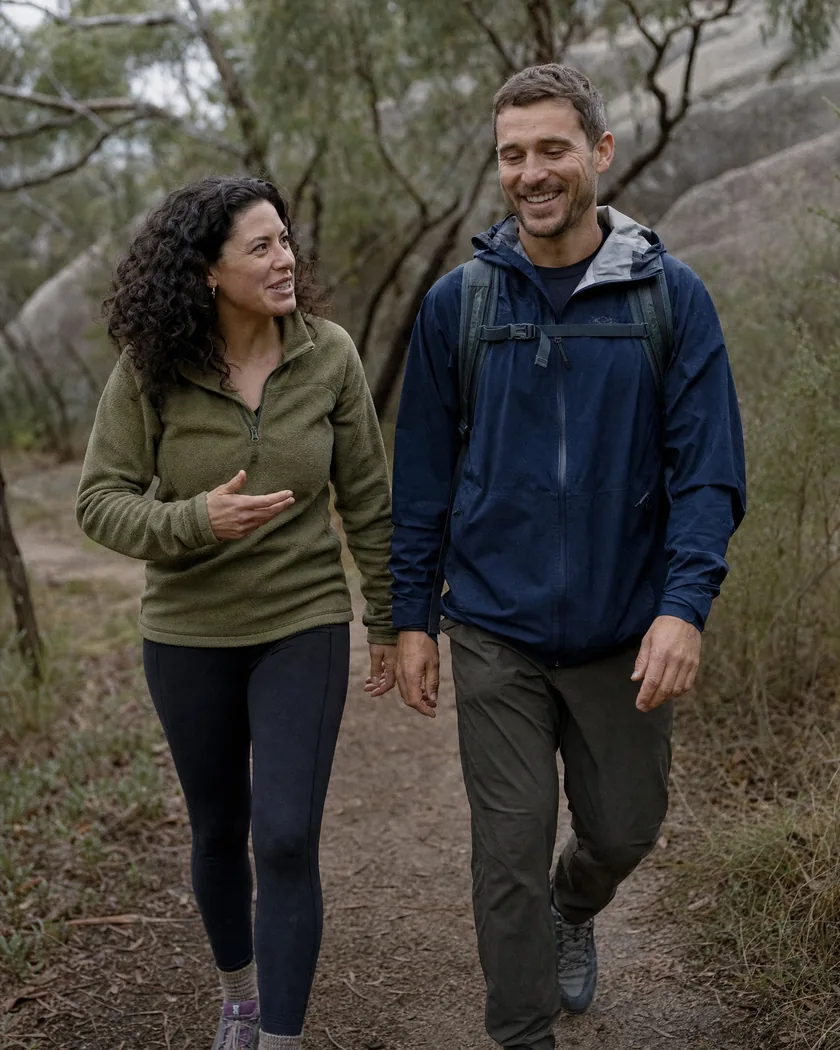 Two friends laughing on a bush walk