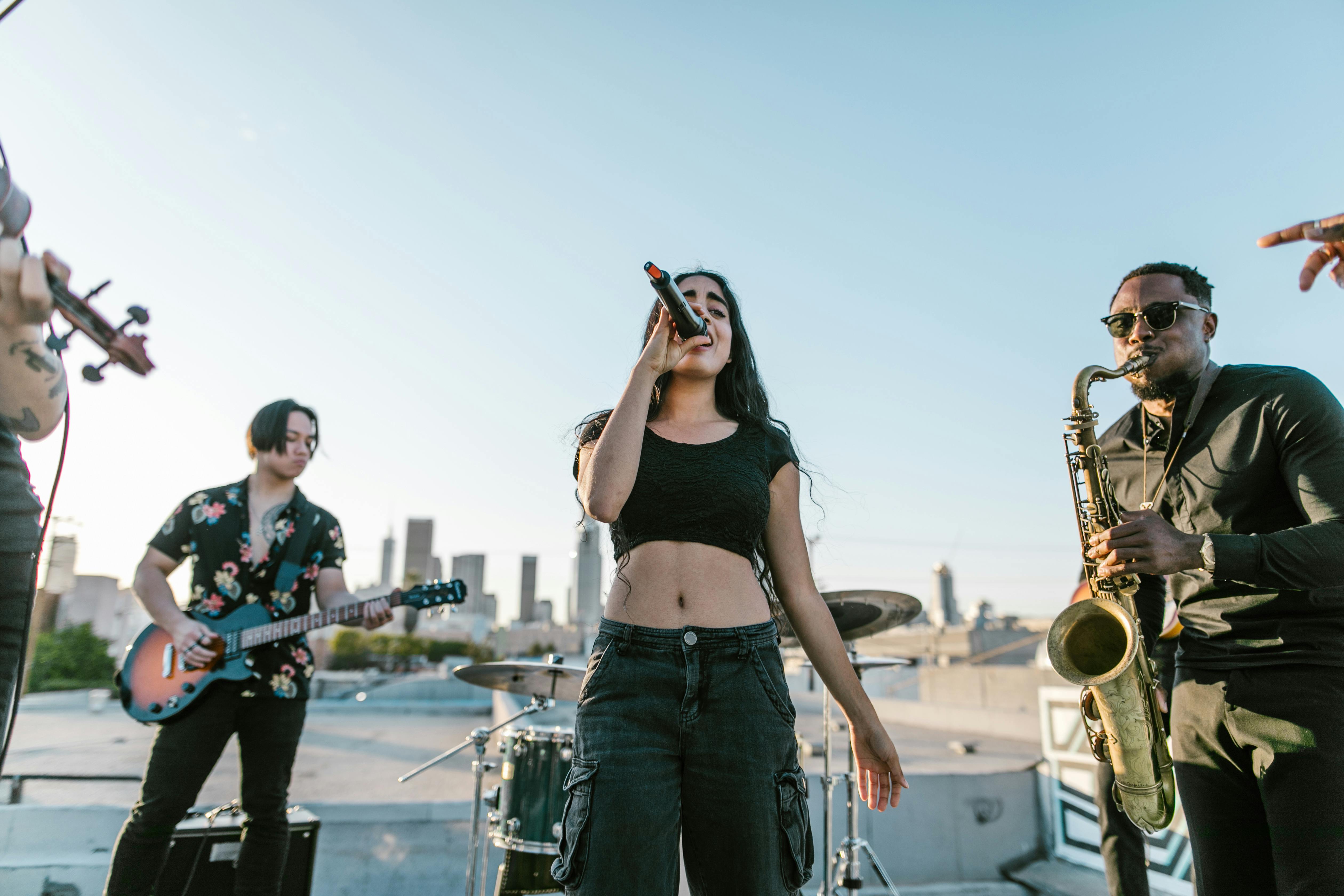 A vibrant start your own local band moment, where a group of passionate musicians performs live on a city street, creating an engaging atmosphere with guitar, keyboard, drums, and bass, while an enthusiastic crowd gathers to enjoy the music.