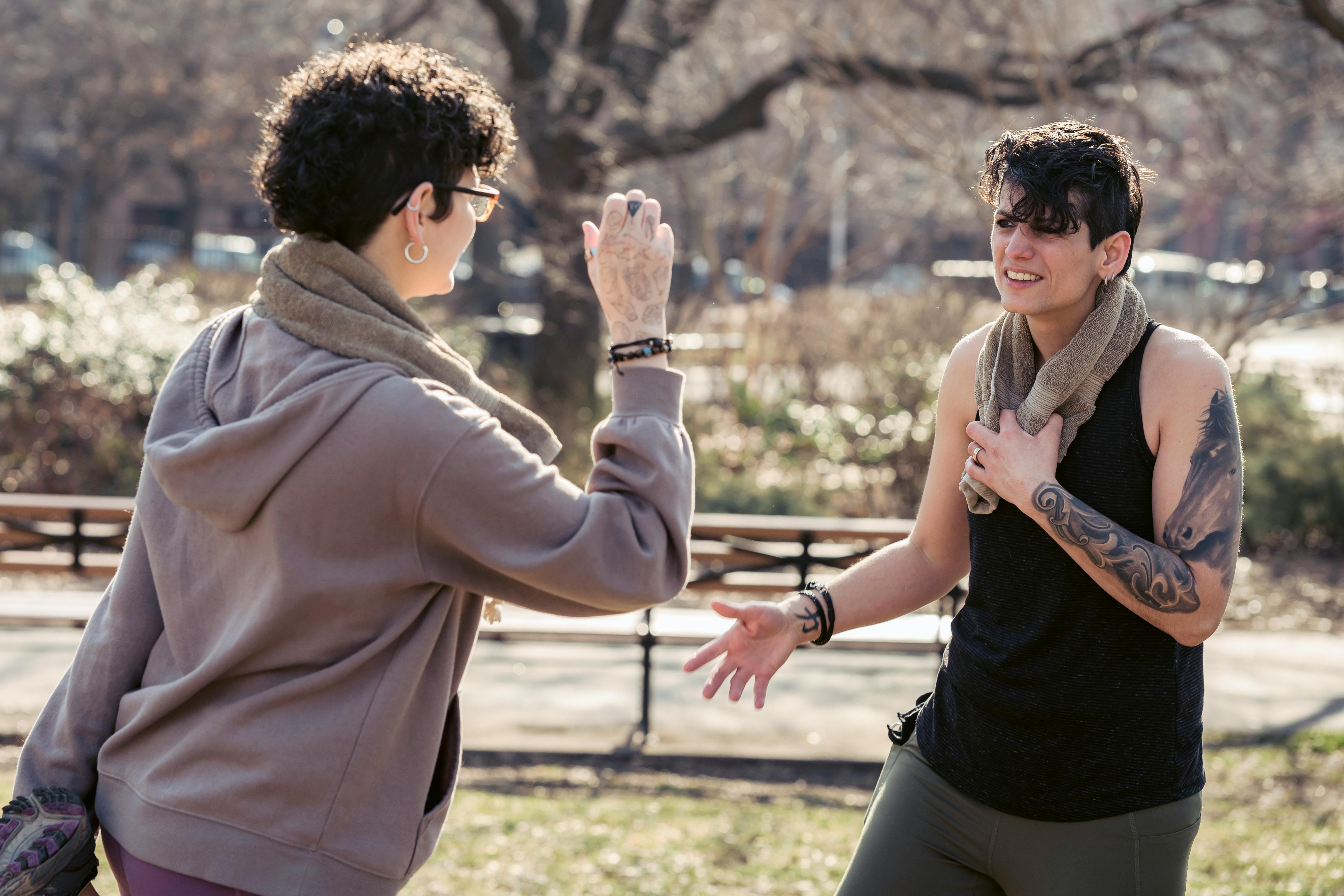 Two new people meeting in a park safely