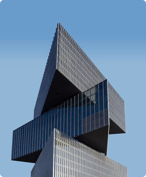 Modern office building with sleek glass facade and contemporary architectural design, representing innovation and professionalism.