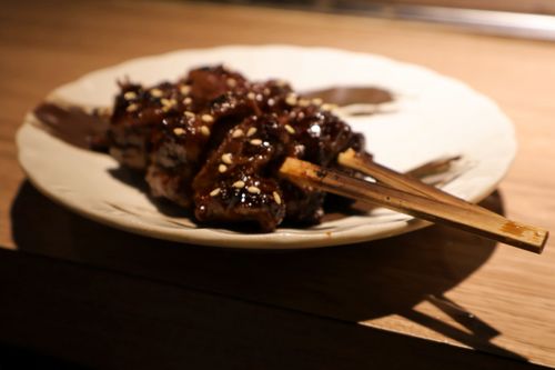 Portions of teriyaki grilled beef short ribs and salted egg yolk water lily shoots from Fengfu Izakaya in Zhongshan District. (Photos by KB, January 2026 / © This Is Taipei)