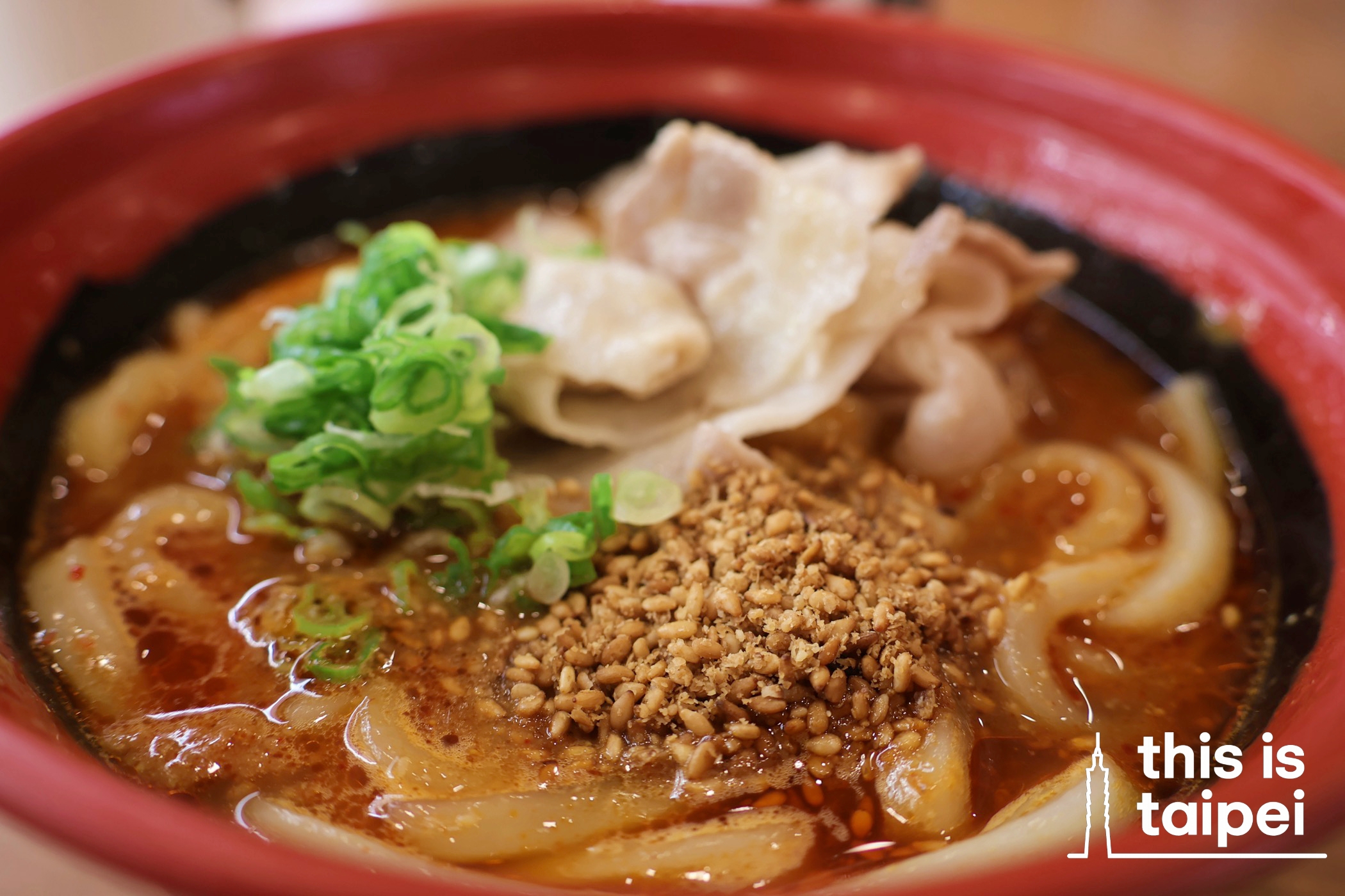 Sushi dishes and a portion of spicy sesame pork udon from Kura in Xinyi District. (Photos by KB, August 2026 / © This Is Taipei)