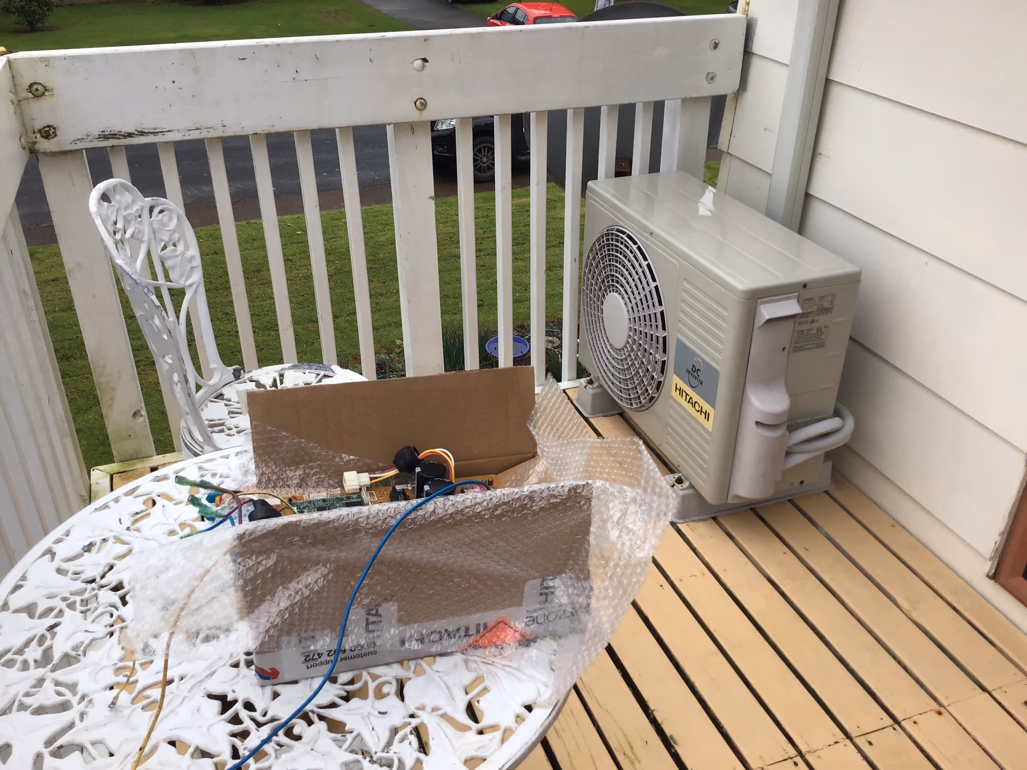 Heat pump outdoor unit and electronic components during repair work