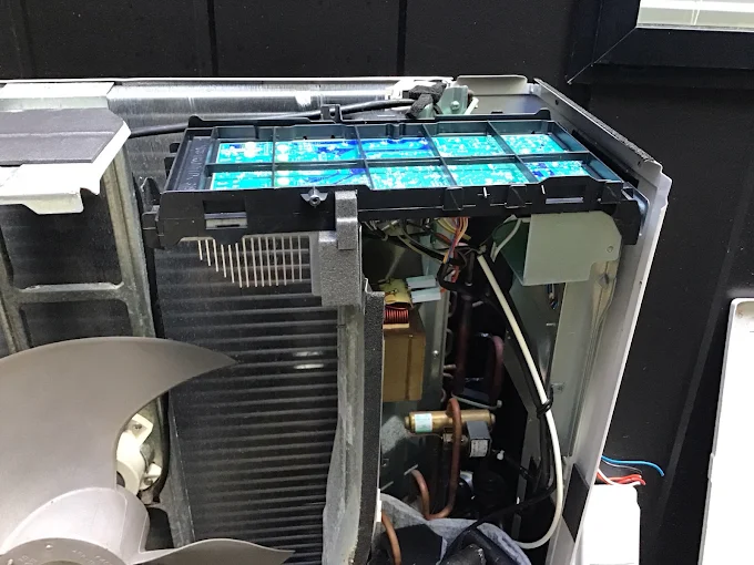 Outdoor Panasonic heat pump beside an Auckland home