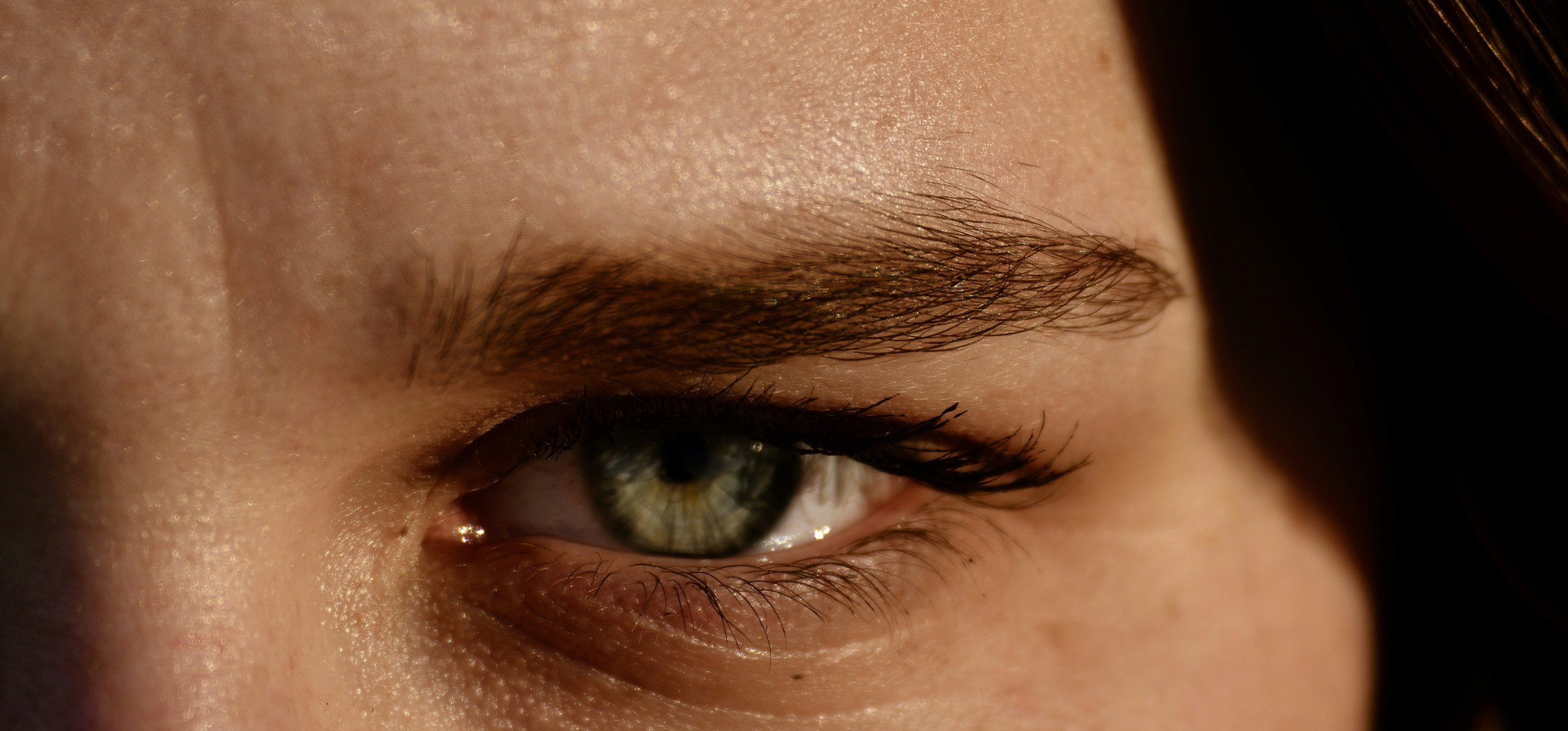 A close-up of a tired eye with shadows beneath it