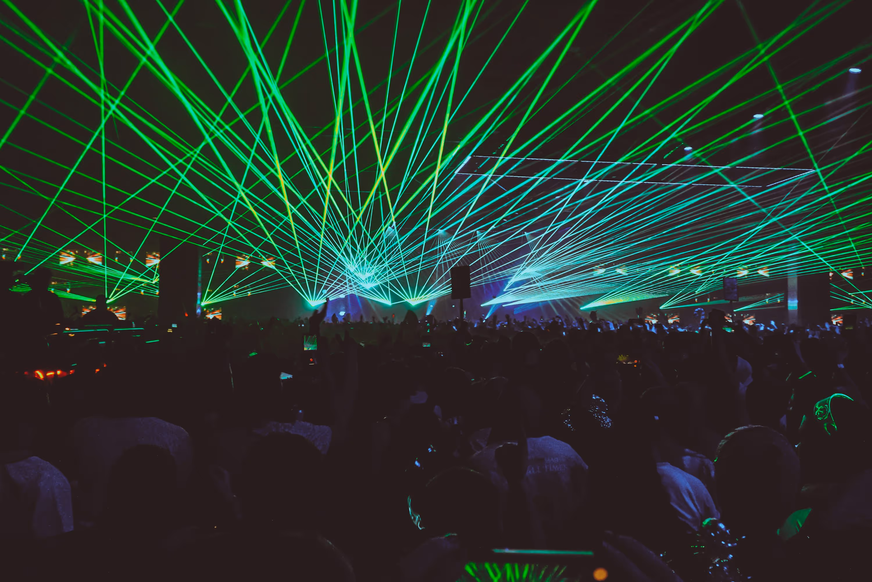 image of a music festival with vibrant colorful smoke