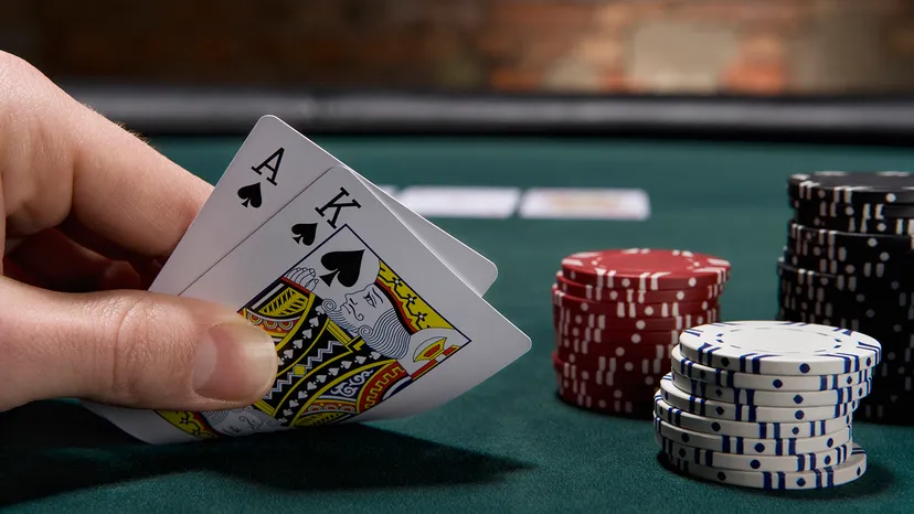 Dealer dealing blackjack cards on table
