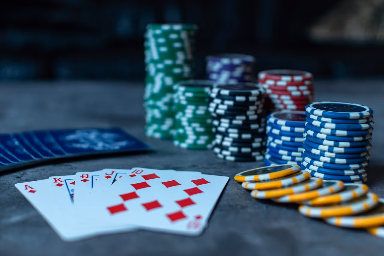 Mixed poker chips in red, black, and green