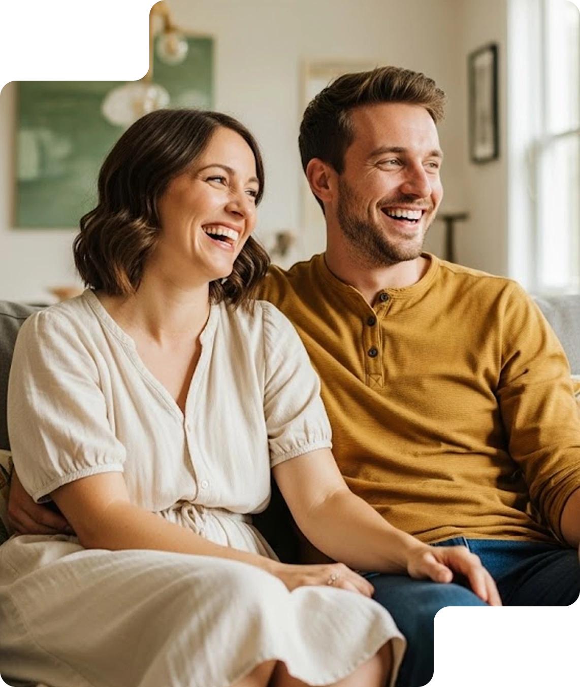 Happy couple sitting on a couch 