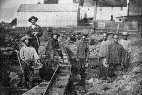Image: American and Chinese miners work a claim at the head of Auburn Ravine with a line of sluice boxes in 1852 (California State Library)
