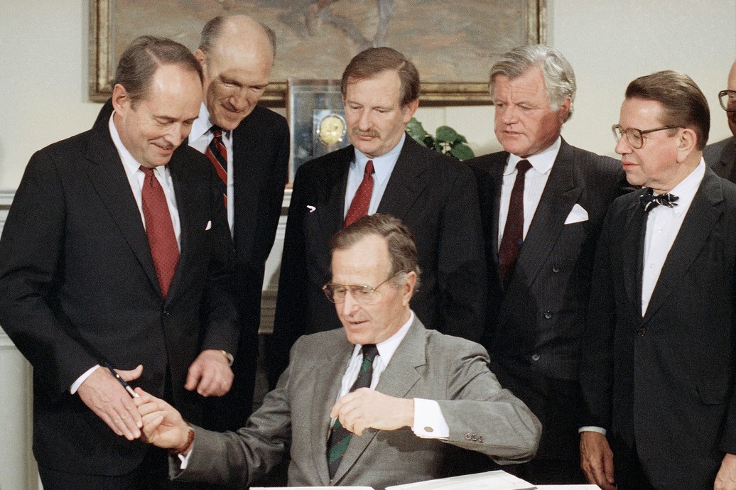 President George H.W. Bush signing immigration legislation