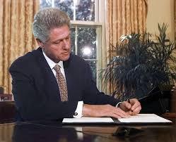 President Bill Clinton signing immigration enforcement legislation