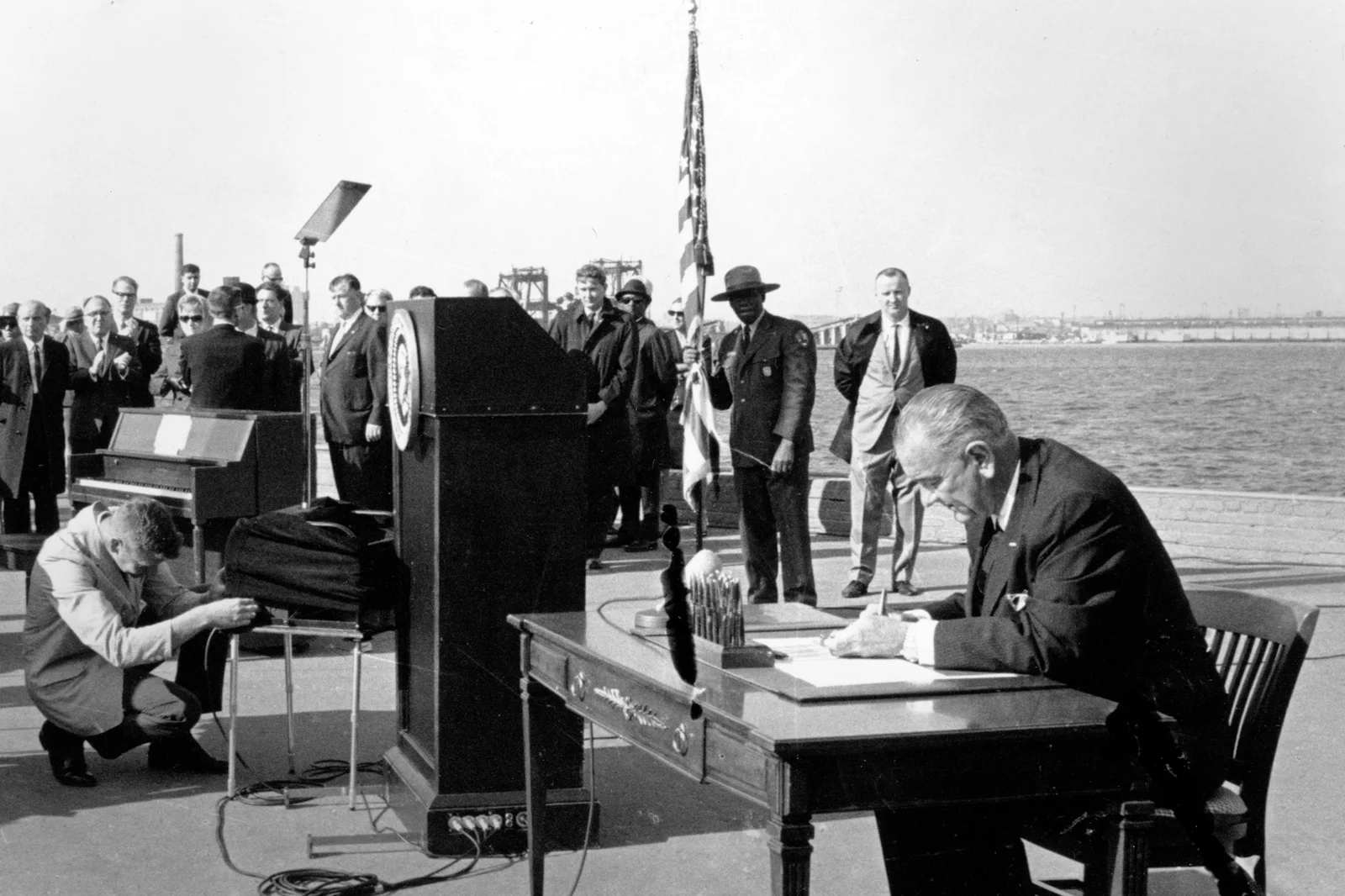 President Johnson signing the Immigration and Nationality Act at the Statue of Liberty