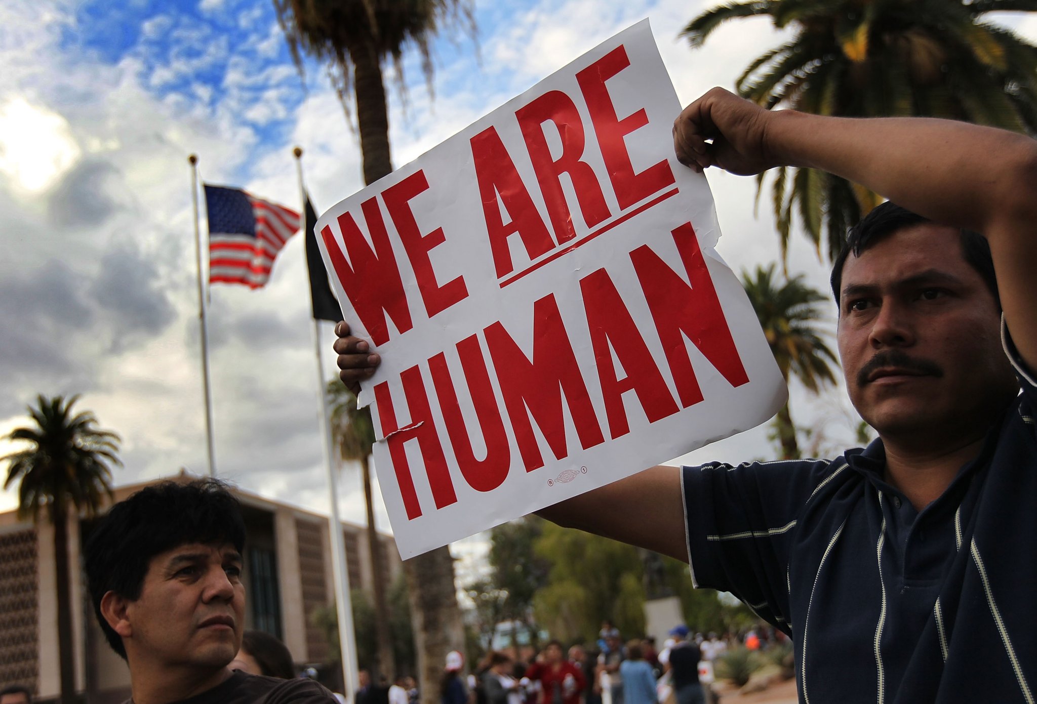 Demonstrators protest Arizona’s new immigration law outside the Arizona Capitol building