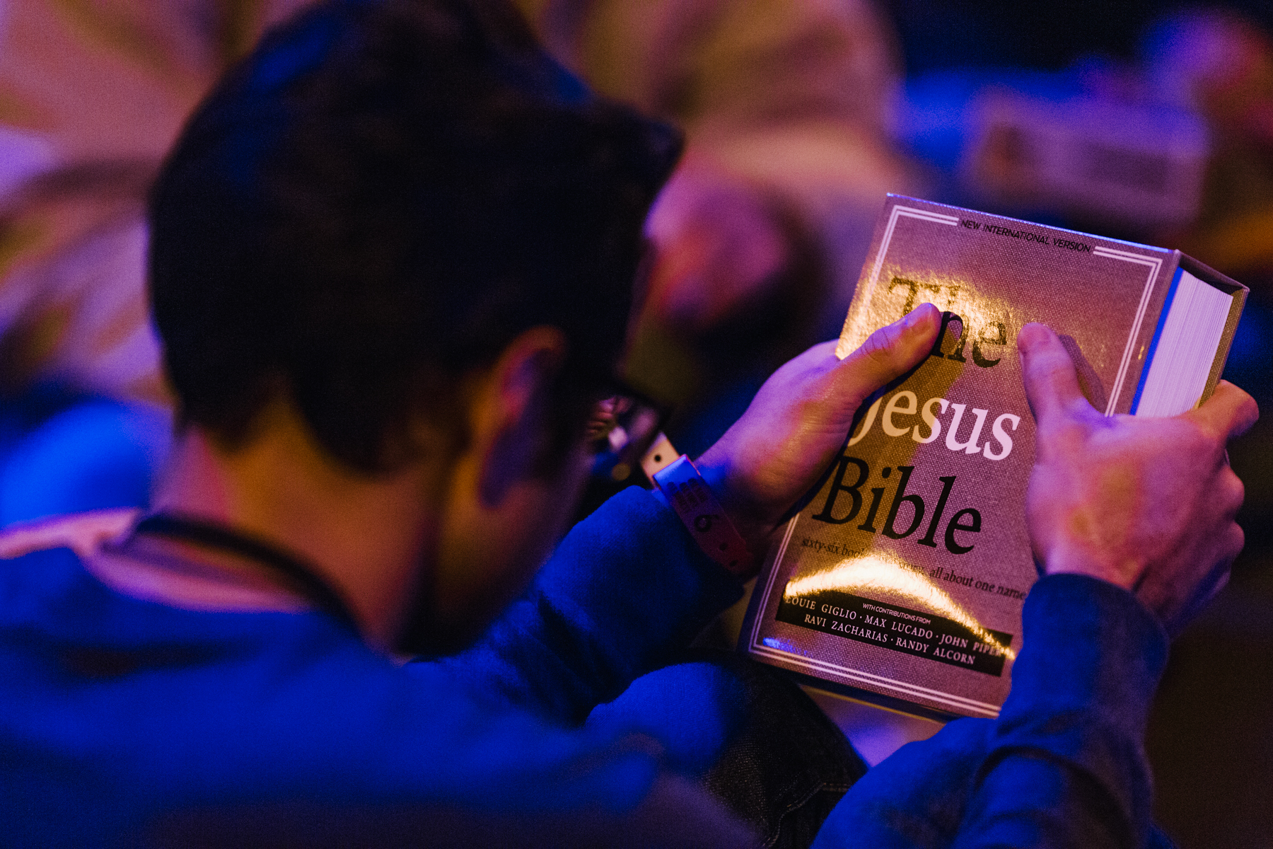 Young man holding The Jesus Bible at Passion Conference 2017