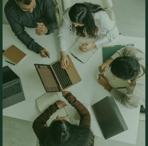 image of team working at a desk