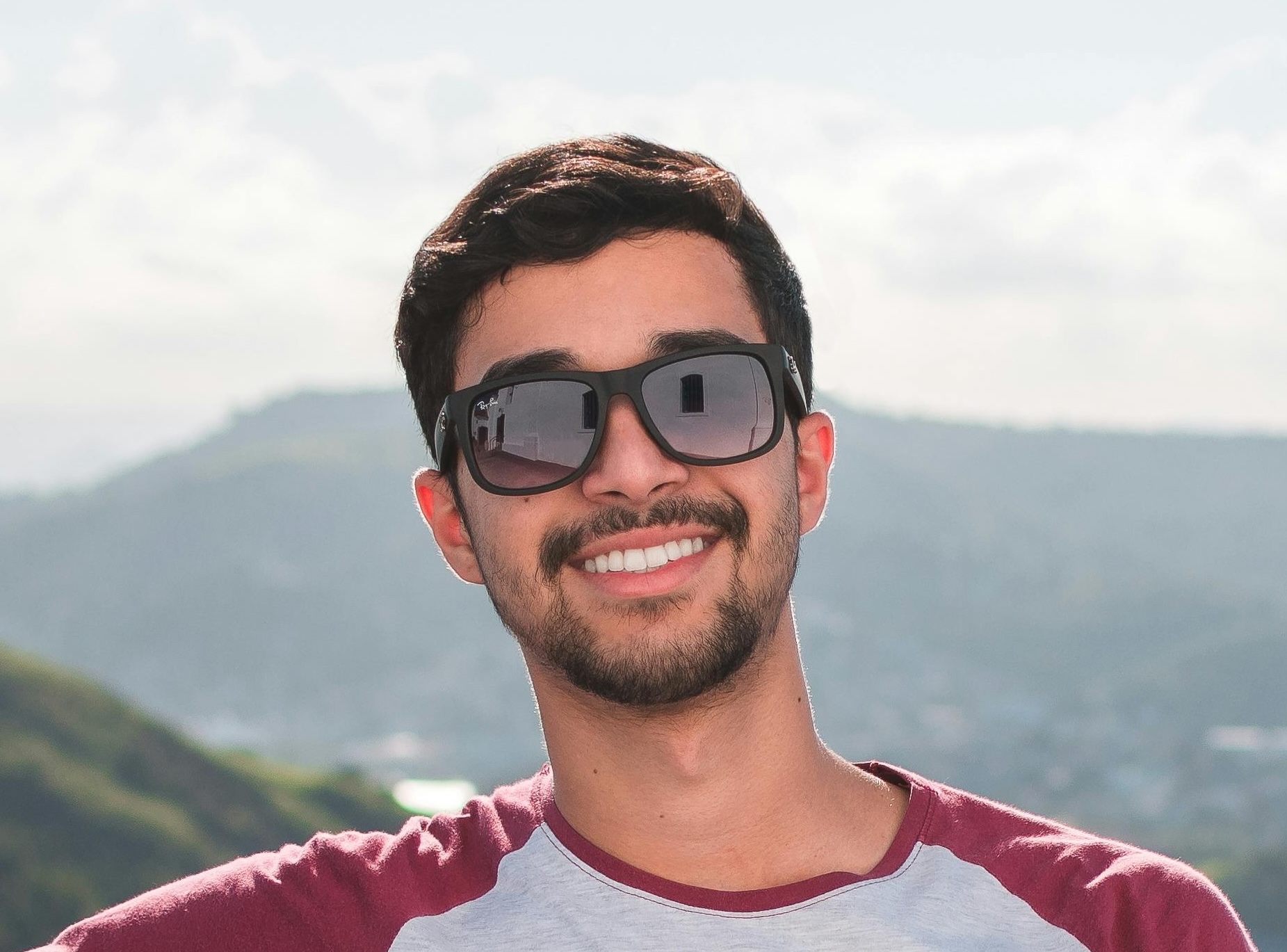 [headshot] image of satisfied student using a laptop