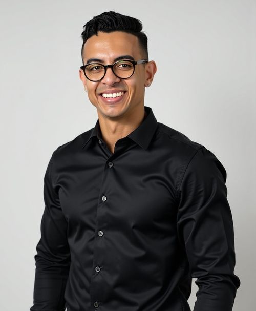 Smiling professional in black shirt and glasses against neutral background