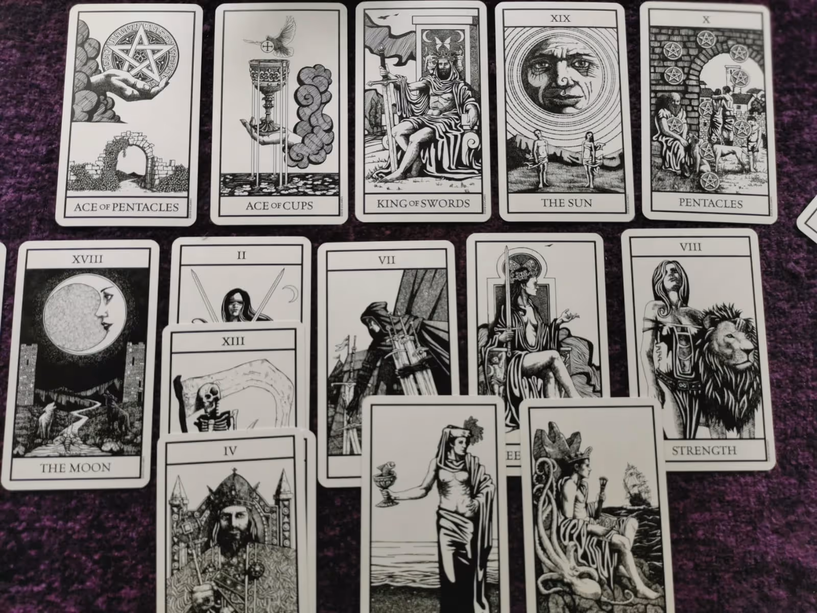 Deep dive Wiccan tarot spread using Bianco Nero tarot cards on a sacred reading table