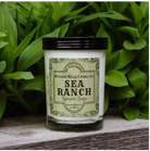Sea ranch soy candle in a glass jar, featuring a natural design and soft, warm light, ideal for creating a cozy atmosphere.