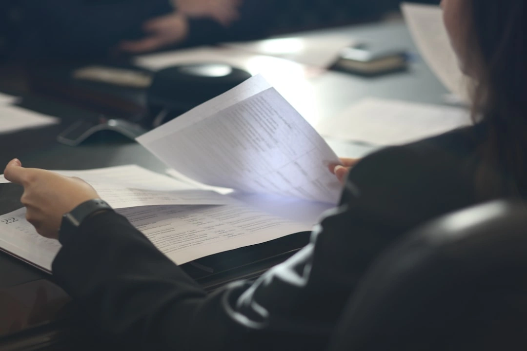 business owner reviewing legal documents and hiring independent contractors business owner reviewing legal documents and hiring independent contractors