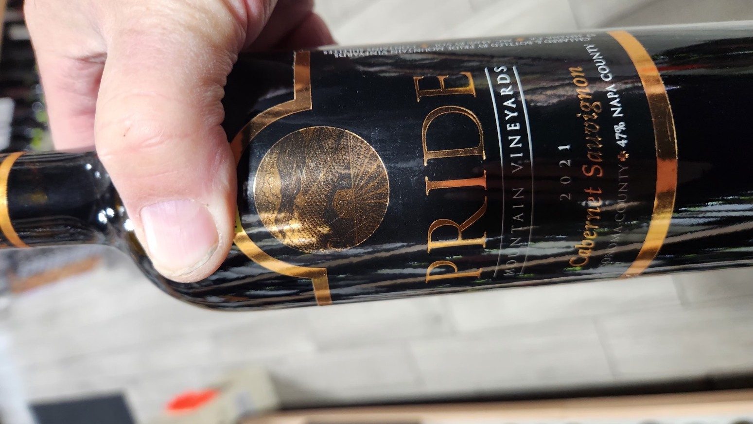 Bottle of Pride Mountain Vineyards 2021 Cabernet Sauvignon held in hand