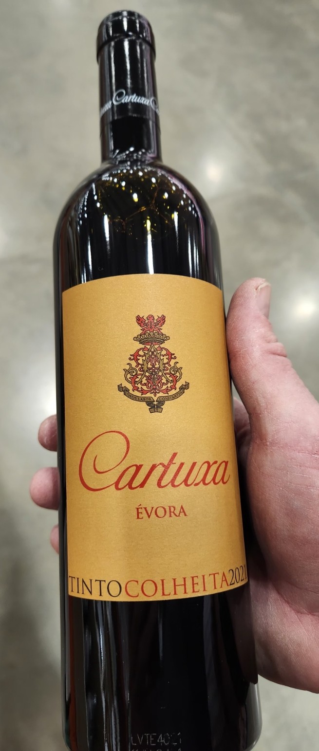 Bottle of Cartuxa Évora Red Tinto Colheita 2021 with shelf tag showing $19.79 price.