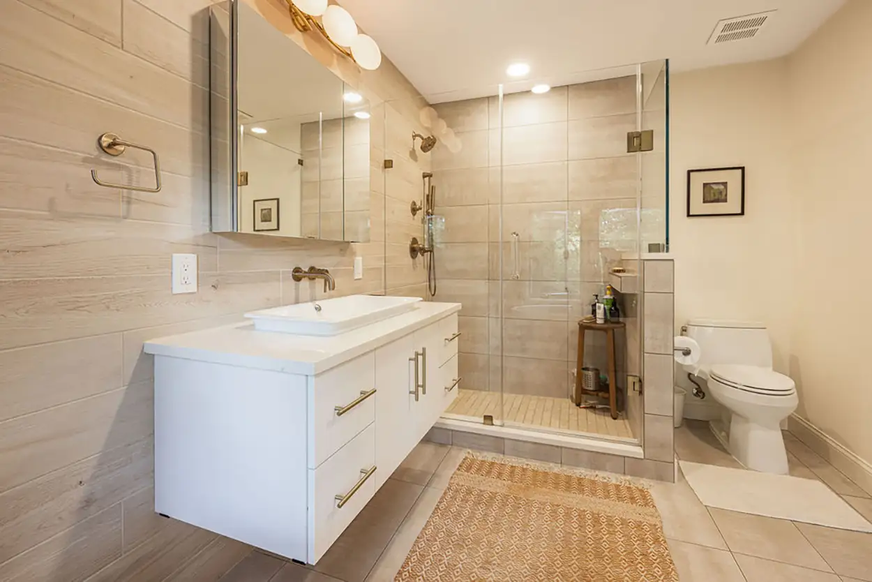 Bathroom renovation in Highlands Ranch, Denver with luxury tile, elegant fixtures, and modern vanities by trusted remodeling contractors.