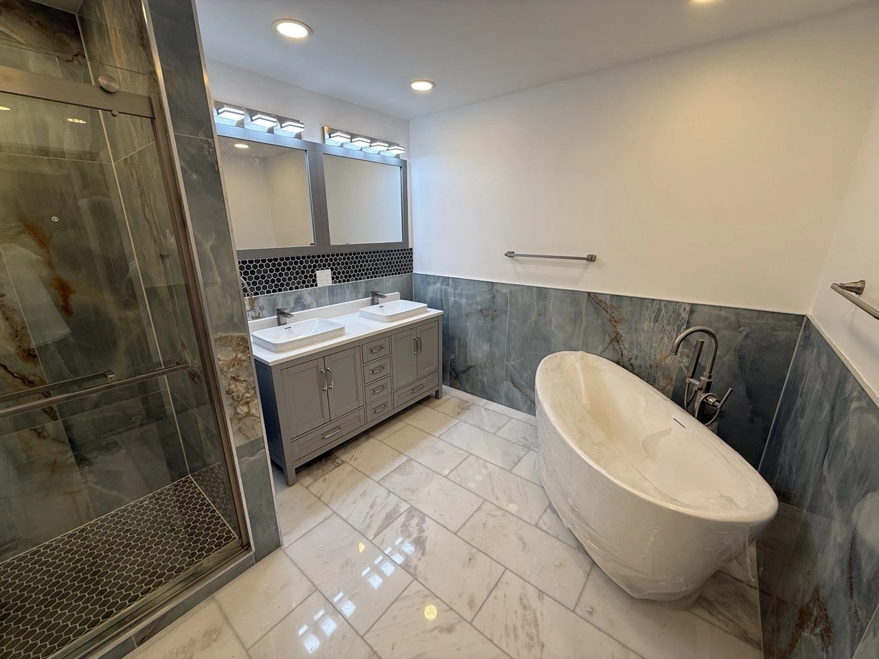 Modern bathroom remodeling with new tiles and vanity in Naperville | TMV Services