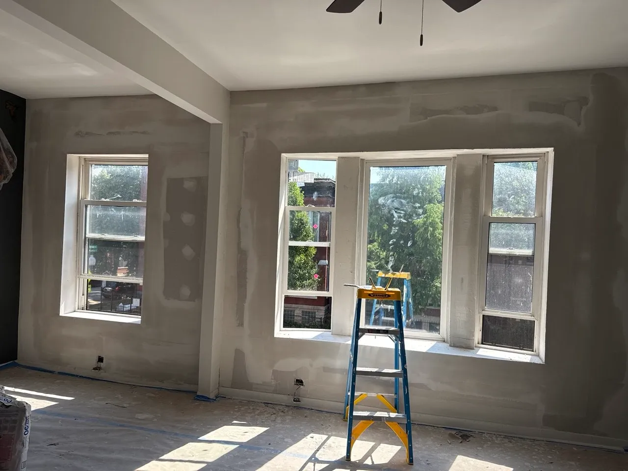 Drywall repair with taping and sanding for a smooth, paint-ready finish