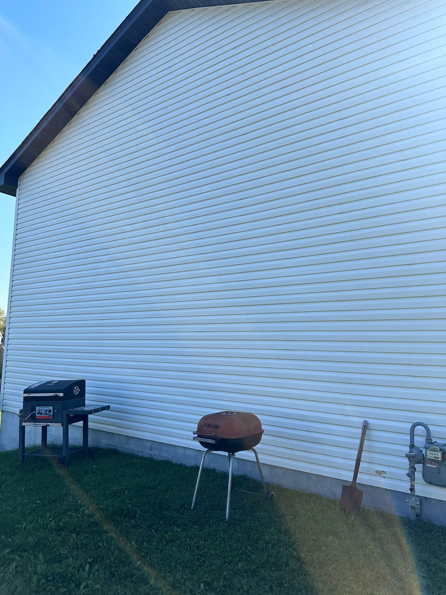 Clean house exterior after Splash and Shine soft washing