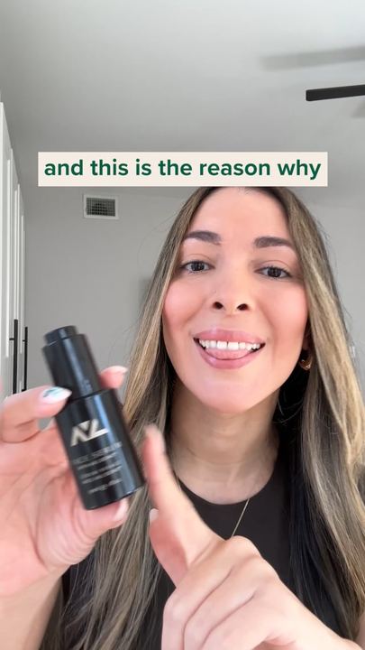 Video ad: a creator holding a serum bottle to camera, captioned and this is the reason why