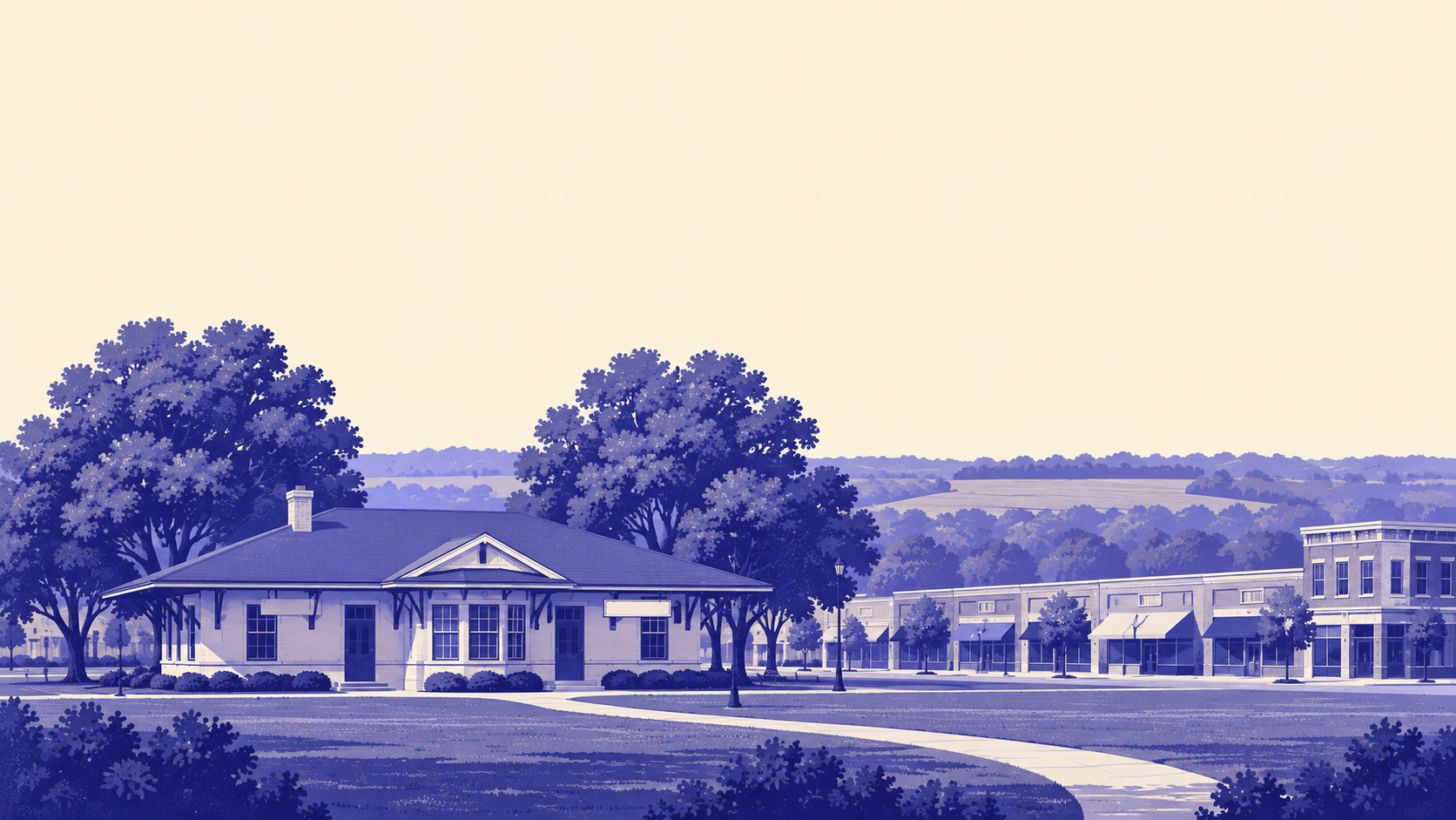 Morning light on downtown Blue Springs, with the 1926 Chicago and Alton railway depot and its deep overhanging eaves in the foreground, the low brick storefronts of the Main Street district behind it, and the rolling wooded country of Jackson County's Fleming Park on the far horizon west of the city.