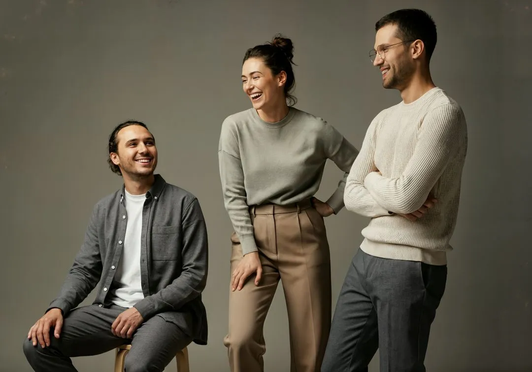A group of three people sitting next to each other.
