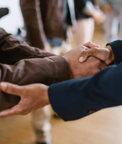 An image of a founder shaking hands with another founder