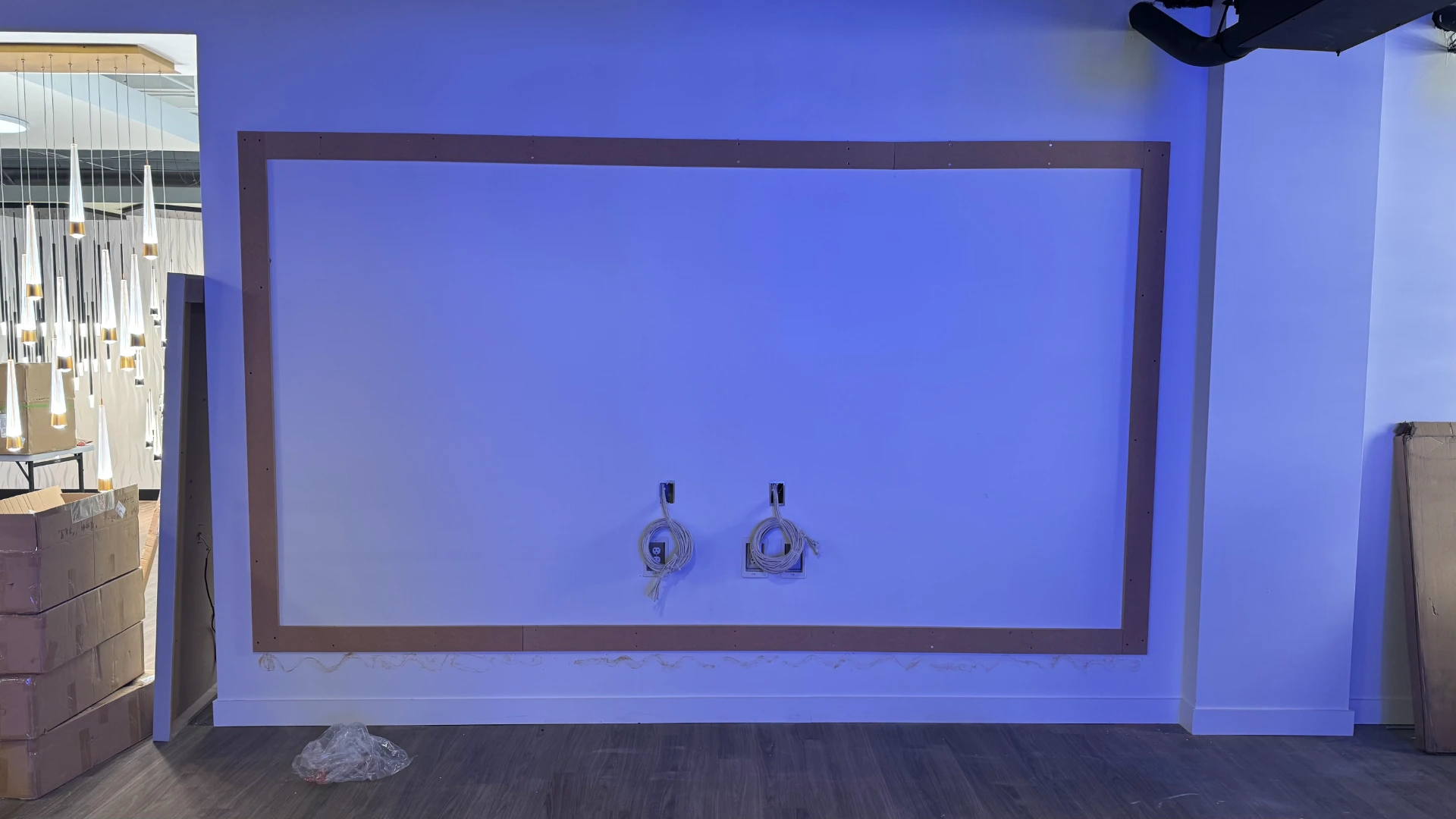 Wall prepped with cabling and border layout for 4K LED video wall installation by CMG Visuals.