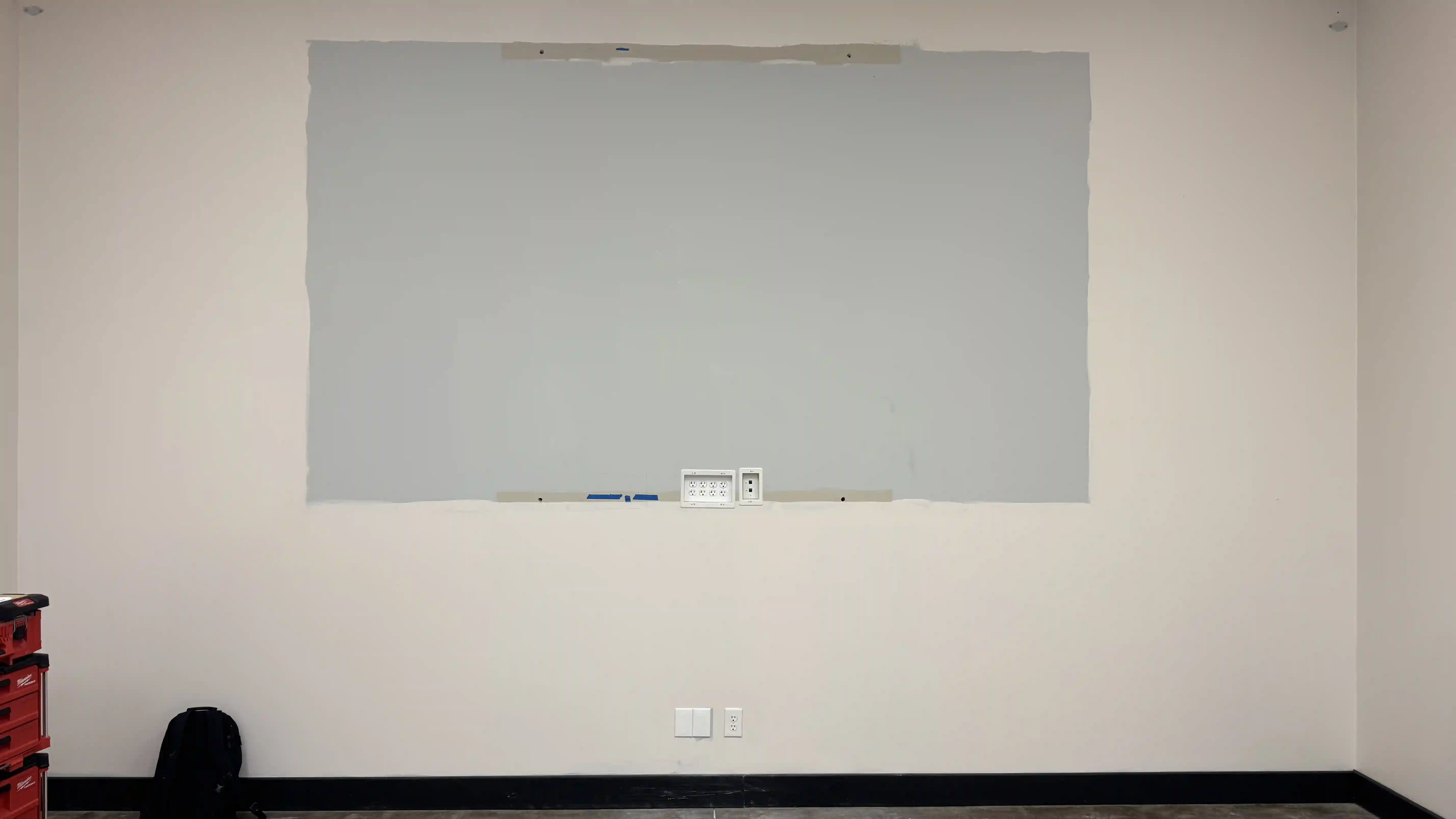 Blank wall before LED screen installation for Gemmy Industries meeting room