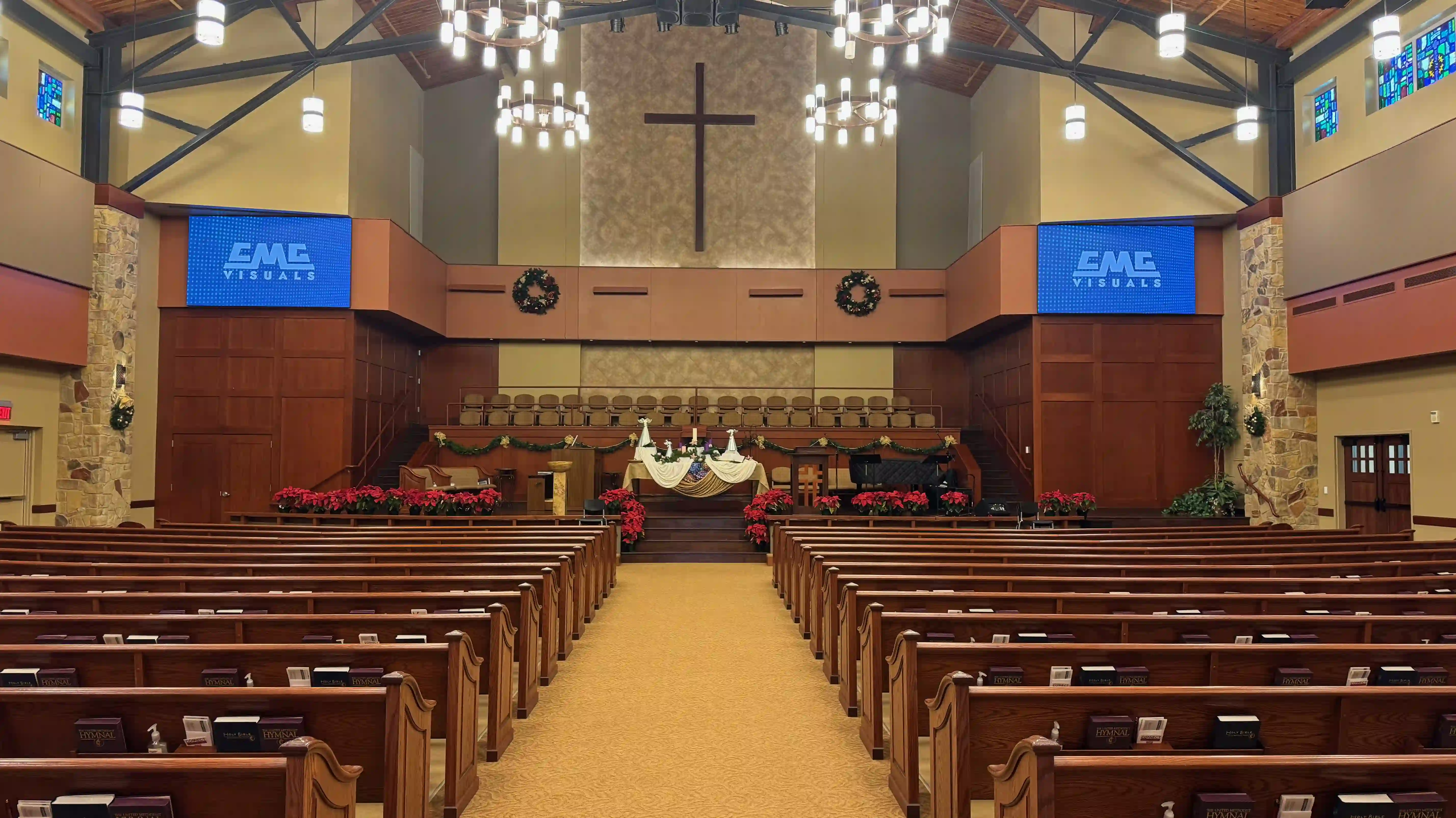 A wide-angle view of the sanctuary at Grace Avenue Methodist Church in Frisco, TX, showing two large P1.5 LED screens installed on either side of the altar.