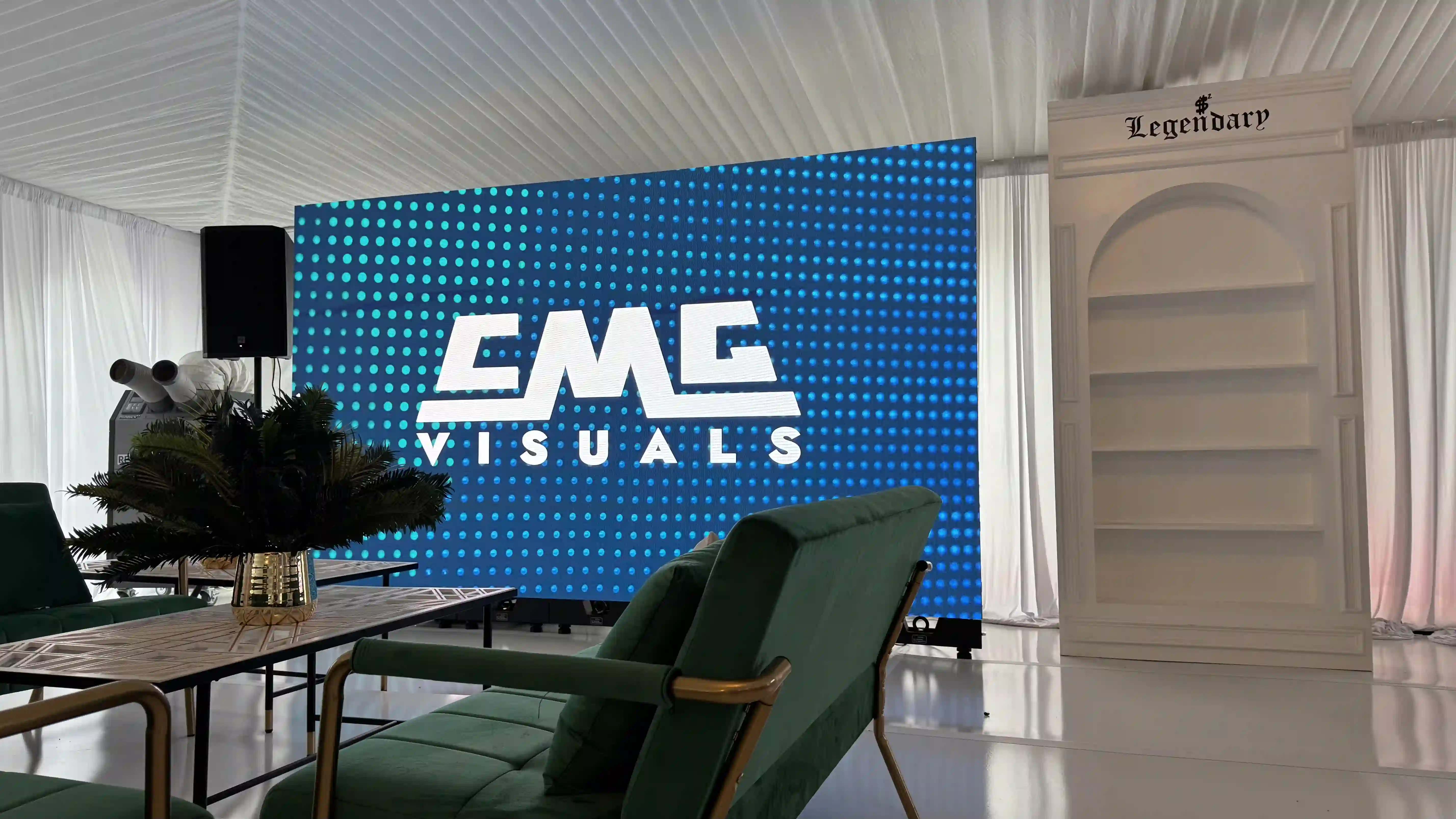 One screen setup side by side for Deion Sanders draft party.